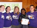 A Summer Camp Participant receiving a Certificate Participation